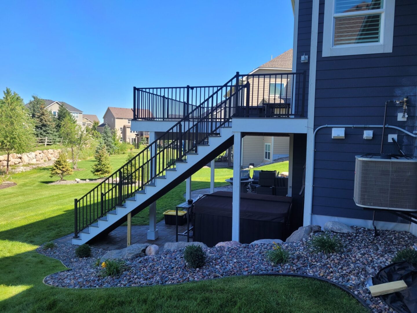 deck dark railing side stairs view scaled