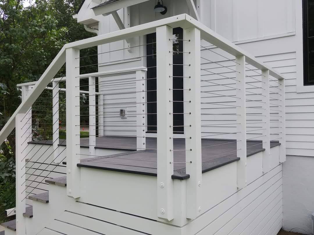 deck with white railing stairs view