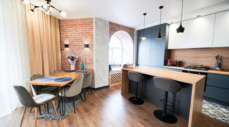 A kitchen with wooden floors and a table