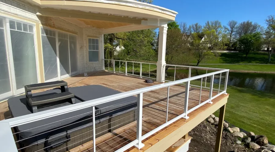 A deck with a couch and table on it