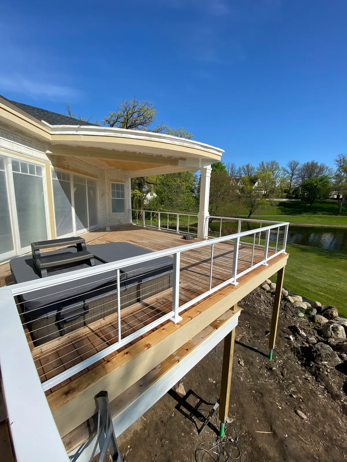 A deck with a couch and table on it