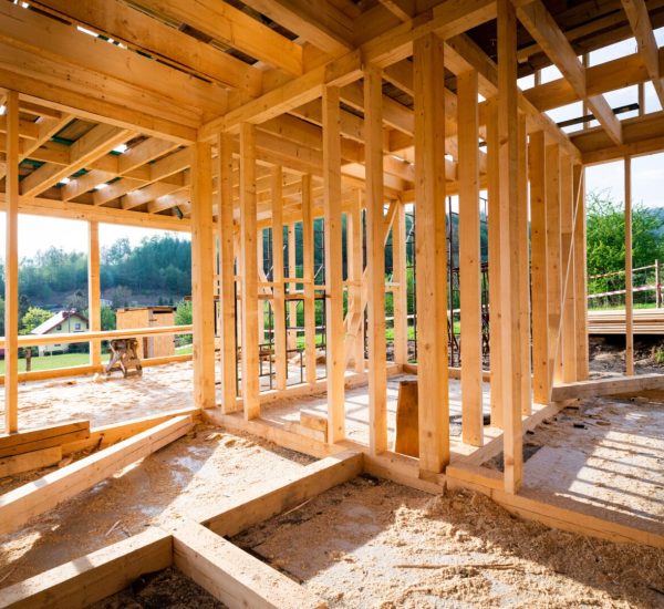 A wooden frame of a house under construction.